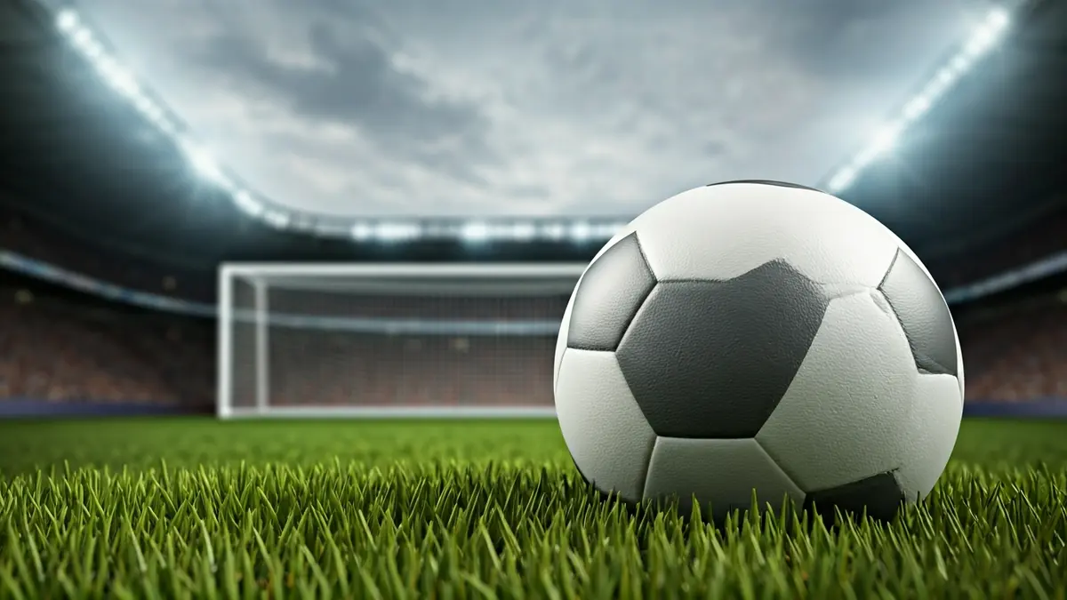 Imaxe xenérica dun balón de fútbol nun campo de herba.