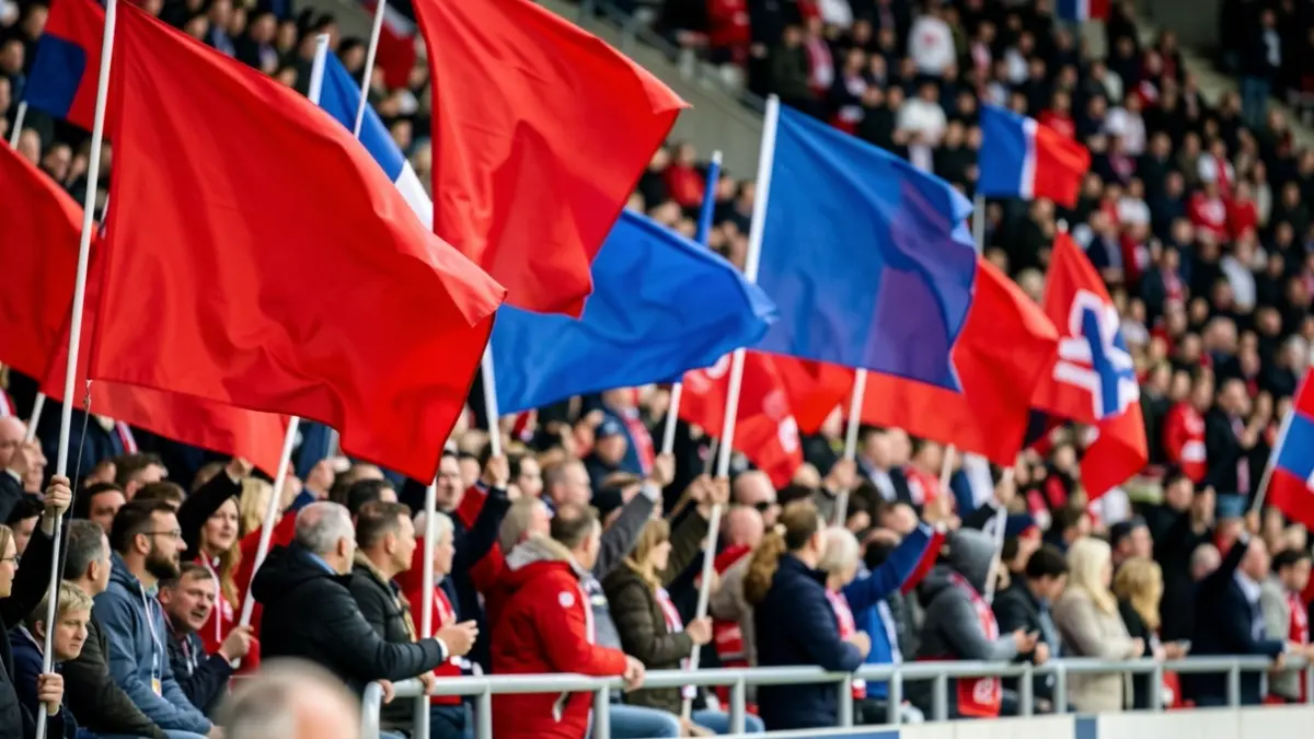 Imagen genérica de aficionados de fútbol con banderas rojas y azules.