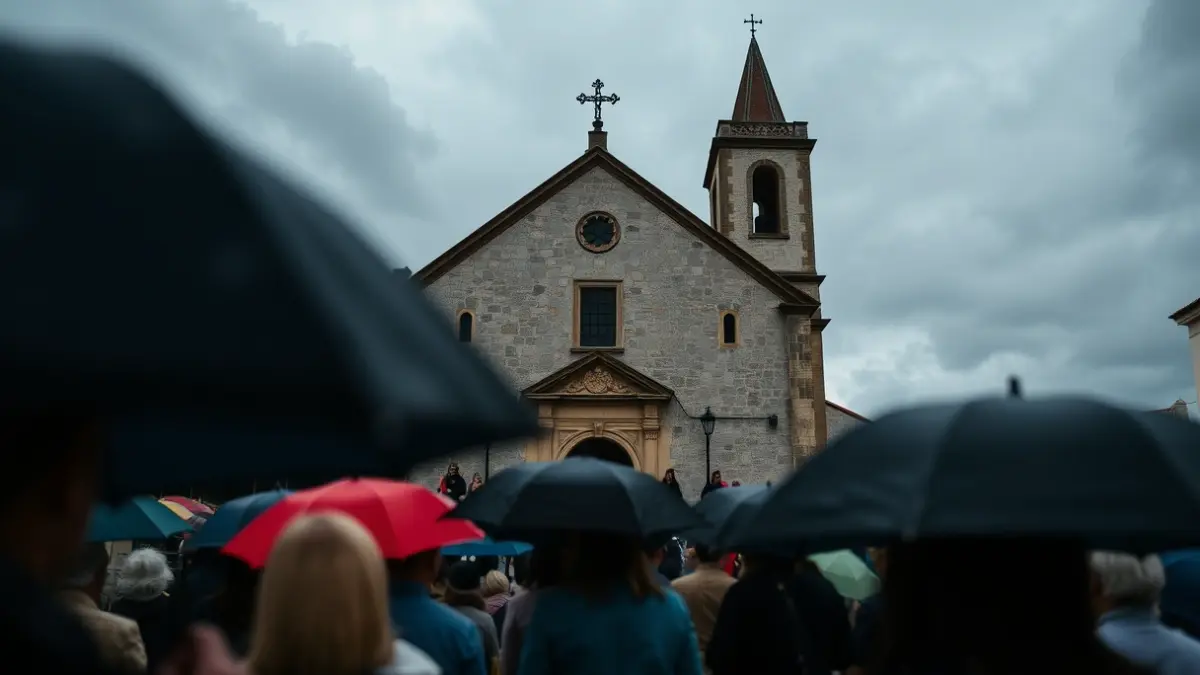 Imaxe dunha procesión relixiosa baixo a choiva nunha vila galega.