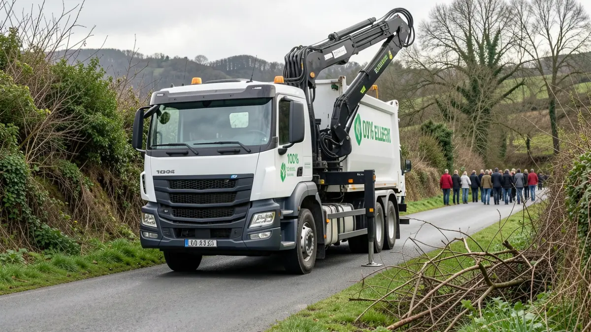 Generic image of an electric truck with a crane and grabber arm on a rural road in Galicia.