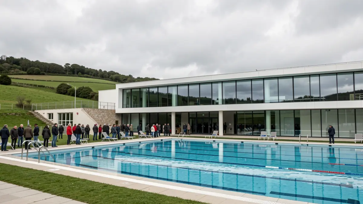 Generic image of a modern sports complex with a swimming pool and Galician landscape.